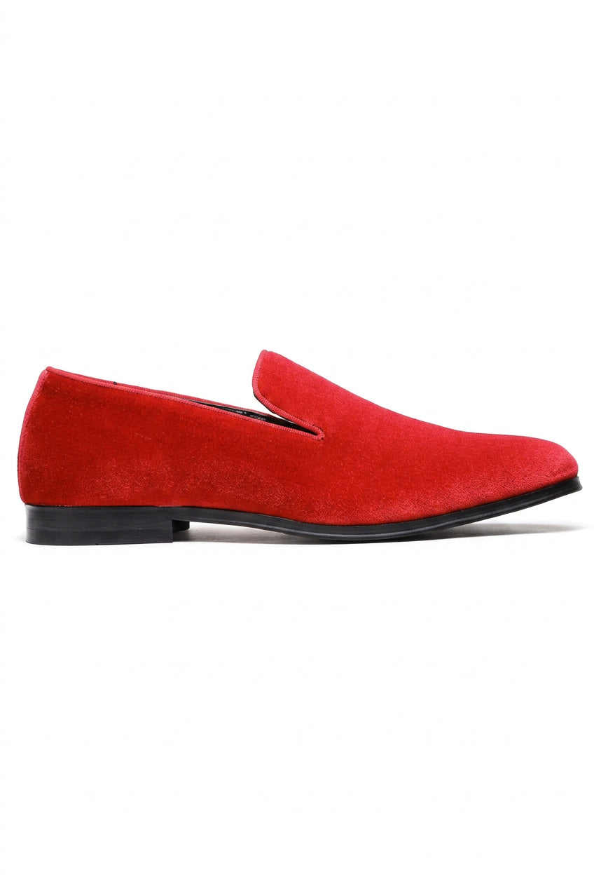 A single red suede slip-on loafer shown in a side profile view against a plain white background.